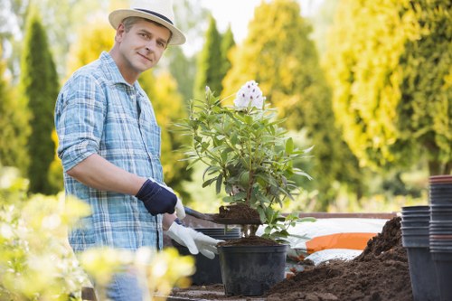 Gardener preparing a free on-site quote